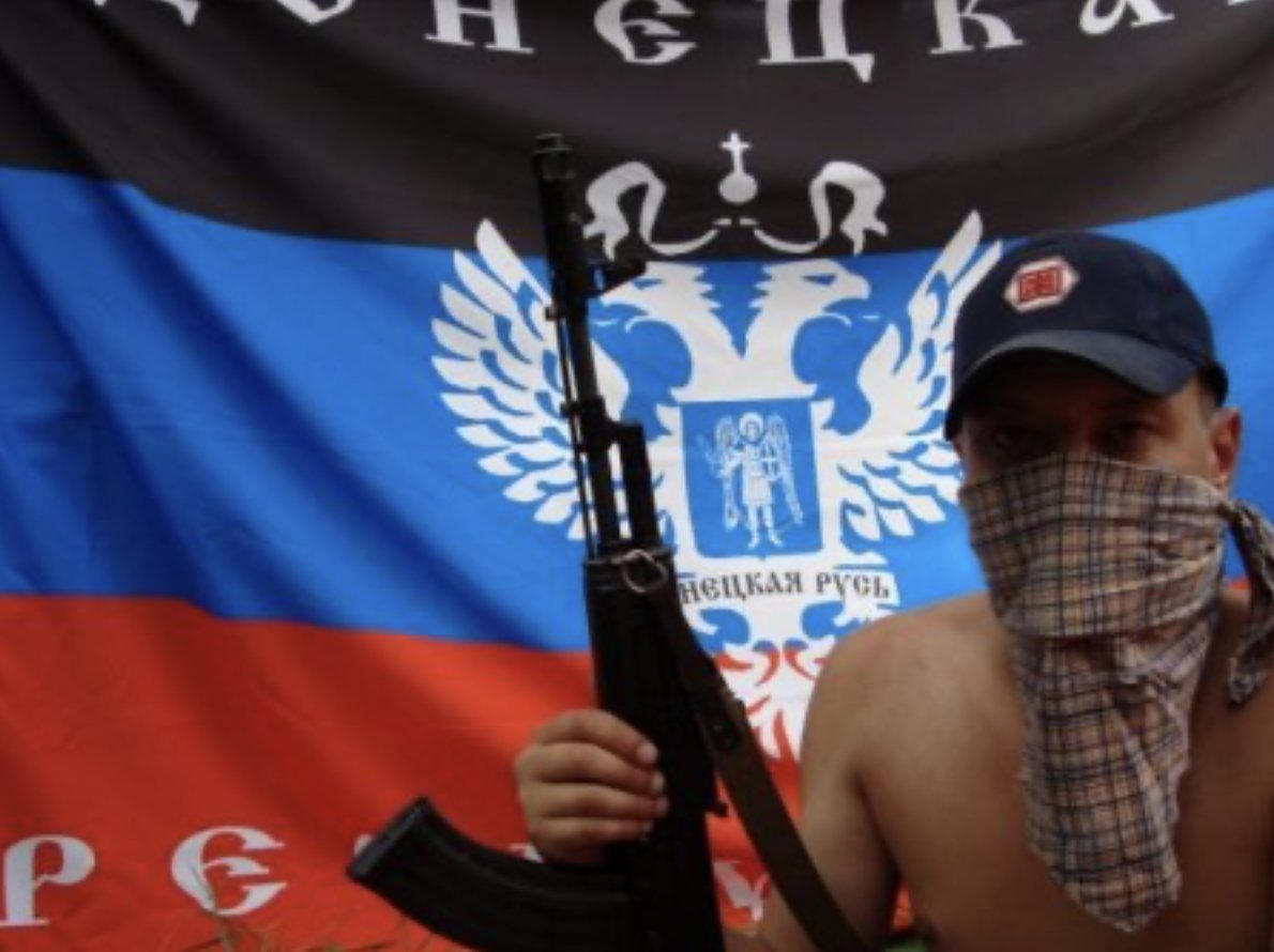 Figure 4: A member of the summer camp poses with an assault rifle